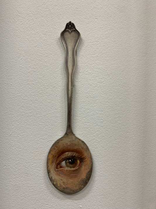 " Eye " on silver spoon