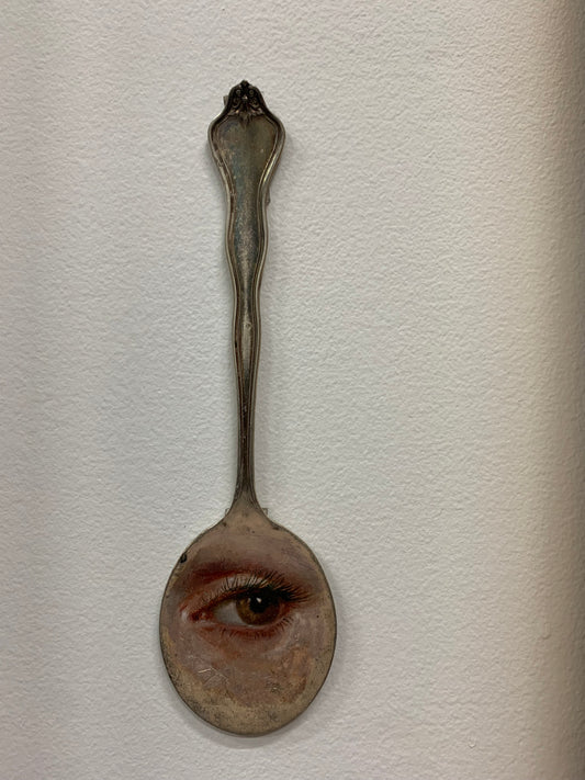 " Eye " on silver spoon